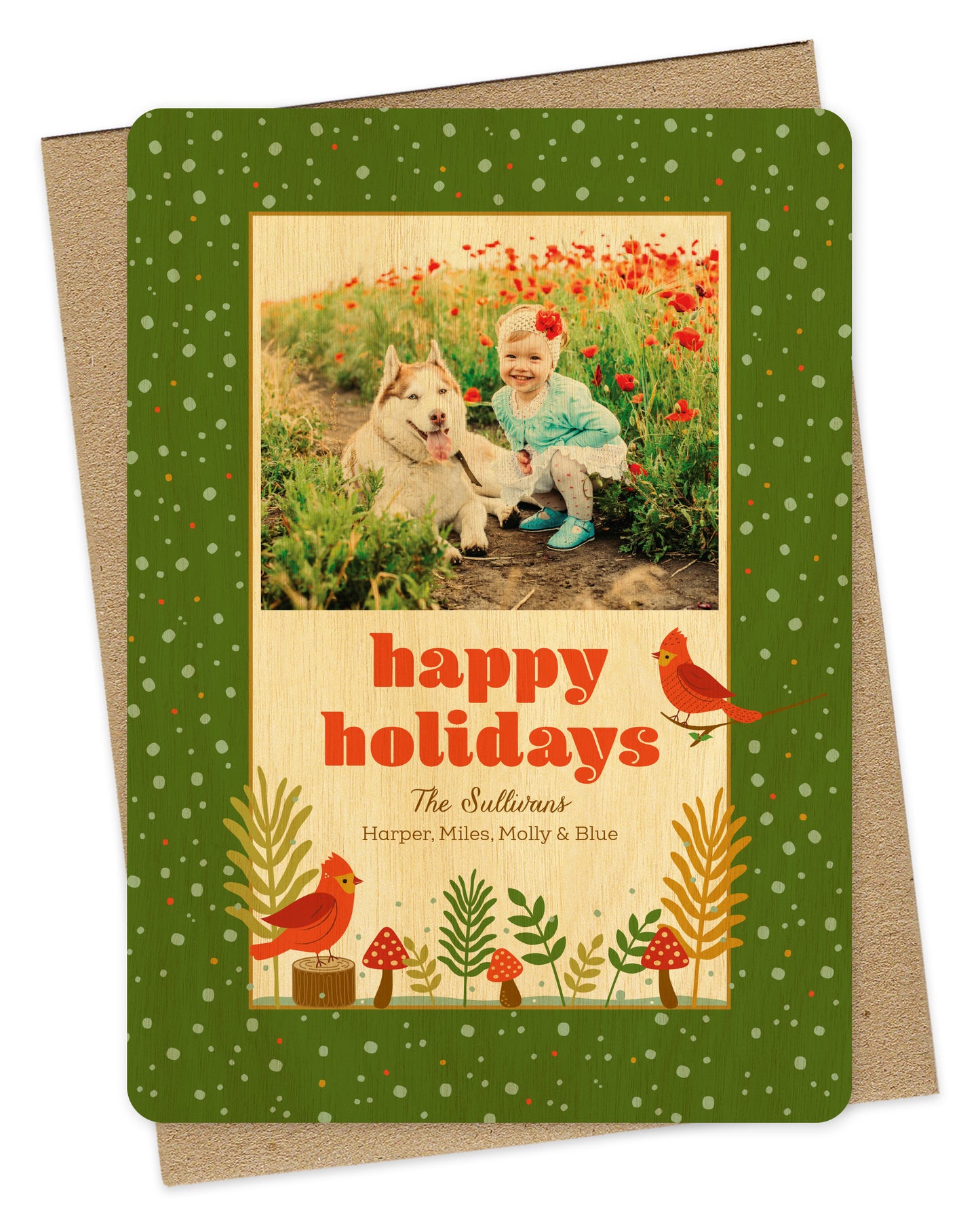 Customizable wood holiday card with a photo area, a woodland illustration of red birds and mushrooms and 'Happy Holidays' text on a kraft envelope.
