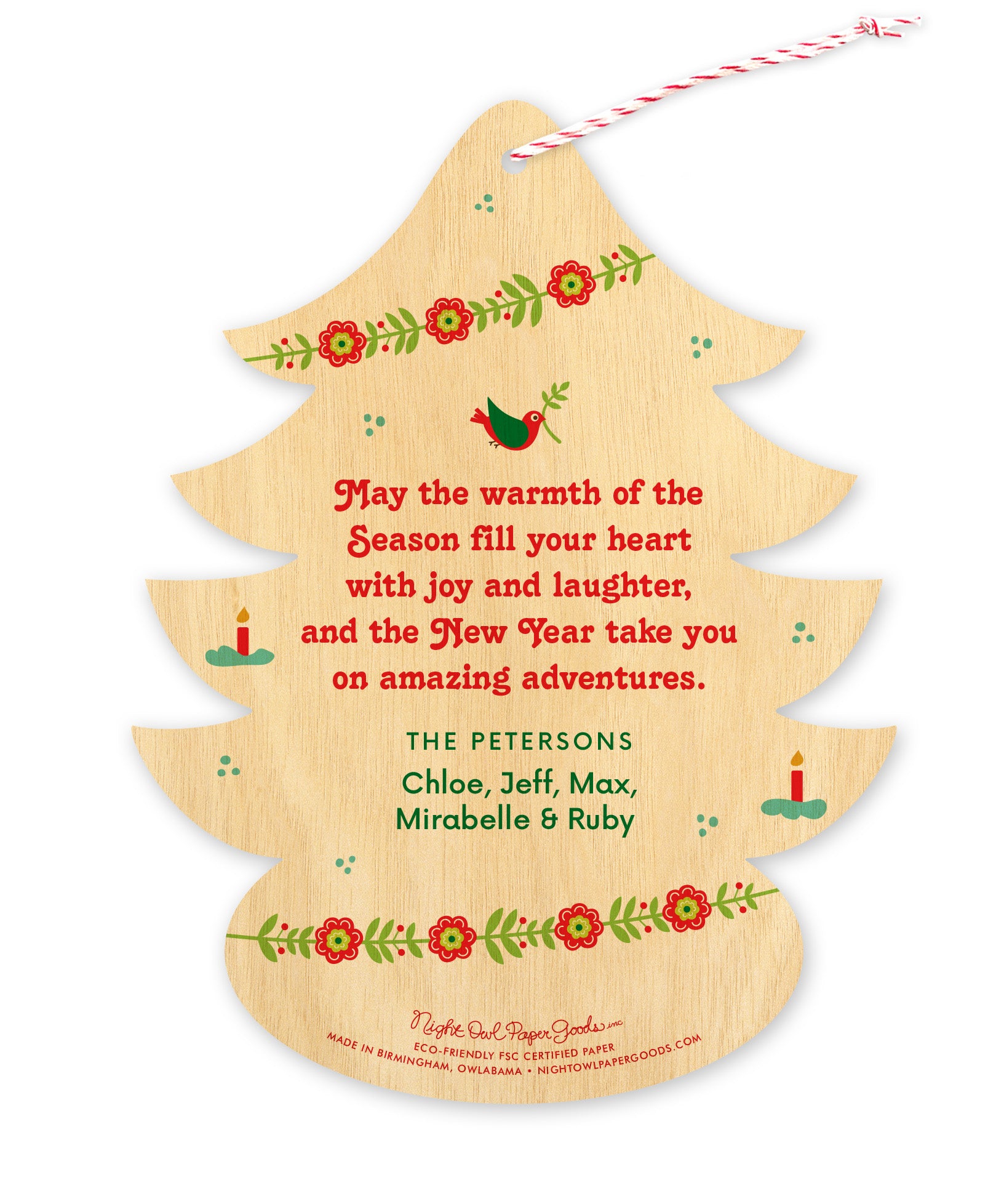 Back of tree-shaped paper Christmas ornament card with corresponding designs and a personal message on a printed birch wood grain background.