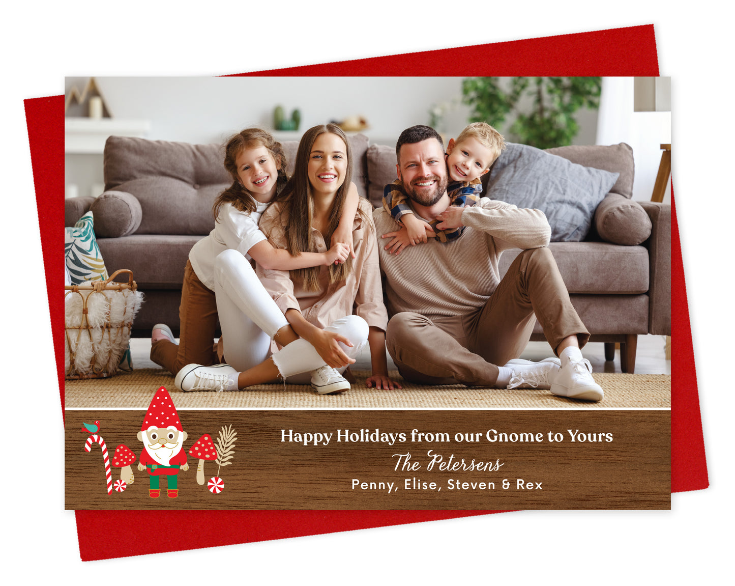 Customizable paper holiday card  featuring a landscape family photo above a printed walnut wood grain border adorned with a cheerful gnome. Text reads 'Happy Holidays from our Gnome to Yours' along with a personal greeting. Shown on a red envelope.