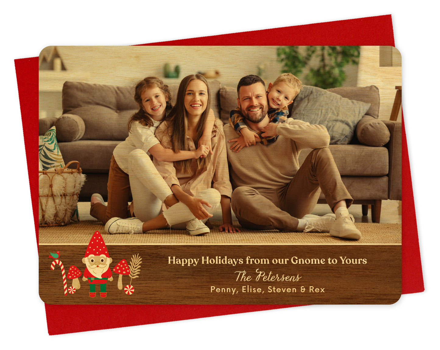 Customizable wood holiday card  featuring a landscape family photo above a printed walnut wood grain border adorned with a cheerful gnome. Text reads 'Happy Holidays from our Gnome to Yours' along with a personal greeting. Shown on a red envelope.