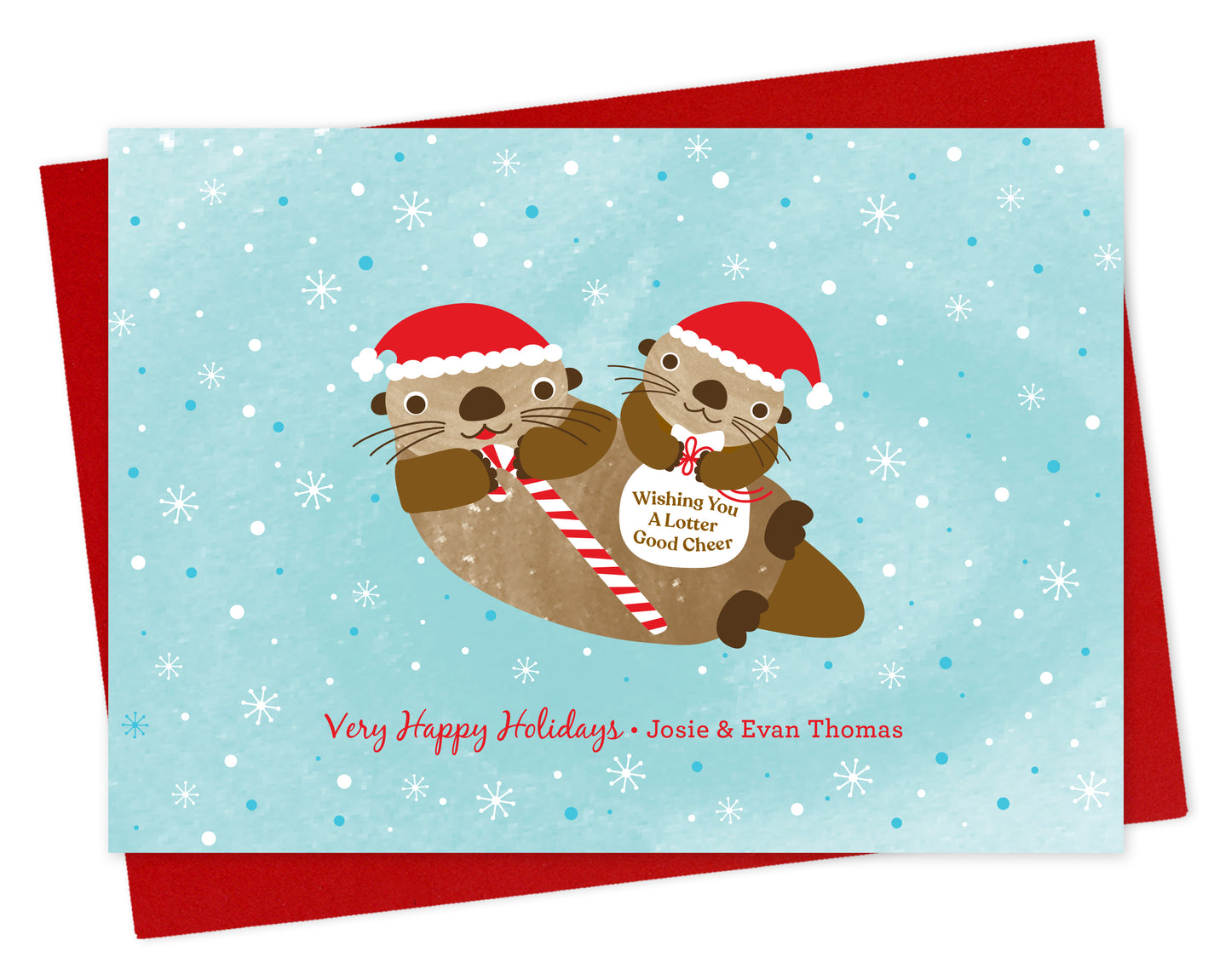 Customizable paper holiday card featuring two otters in Santa hats, one holding a candy cane and one with a “Wishing You A Lotter Good Cheer” bag on a snowy light blue background, along with a personal greeting. Shown with a red envelope.