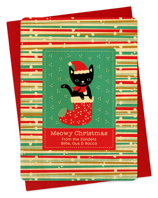 Customizable birch wood holiday card featuring a black cat wearing a santa hat popping out of a stocking bordered by a festive backdrop, a "Meowy Christmas" sentiment and a personal greeting. Shown with a red envelope.
