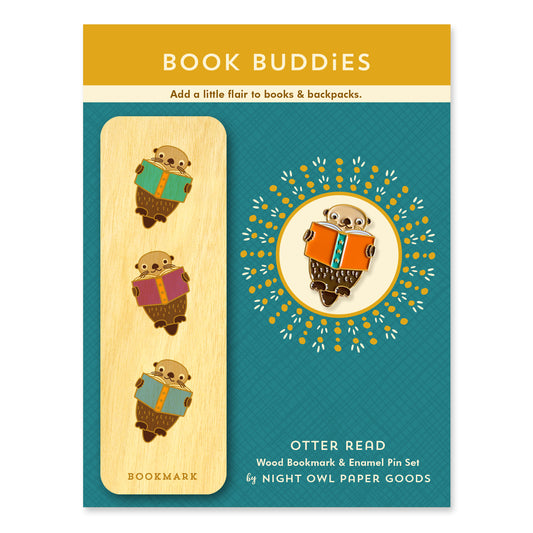 Book Buddies set with a wood bookmark and enamel pin featuring otters reading books. Products are mounted on a backer card that says Book Buddies, Add a little flair to books & backpacks. Otter Read Wood Bookmark & Enamel Pin Set by Night Owl Paper Goods.