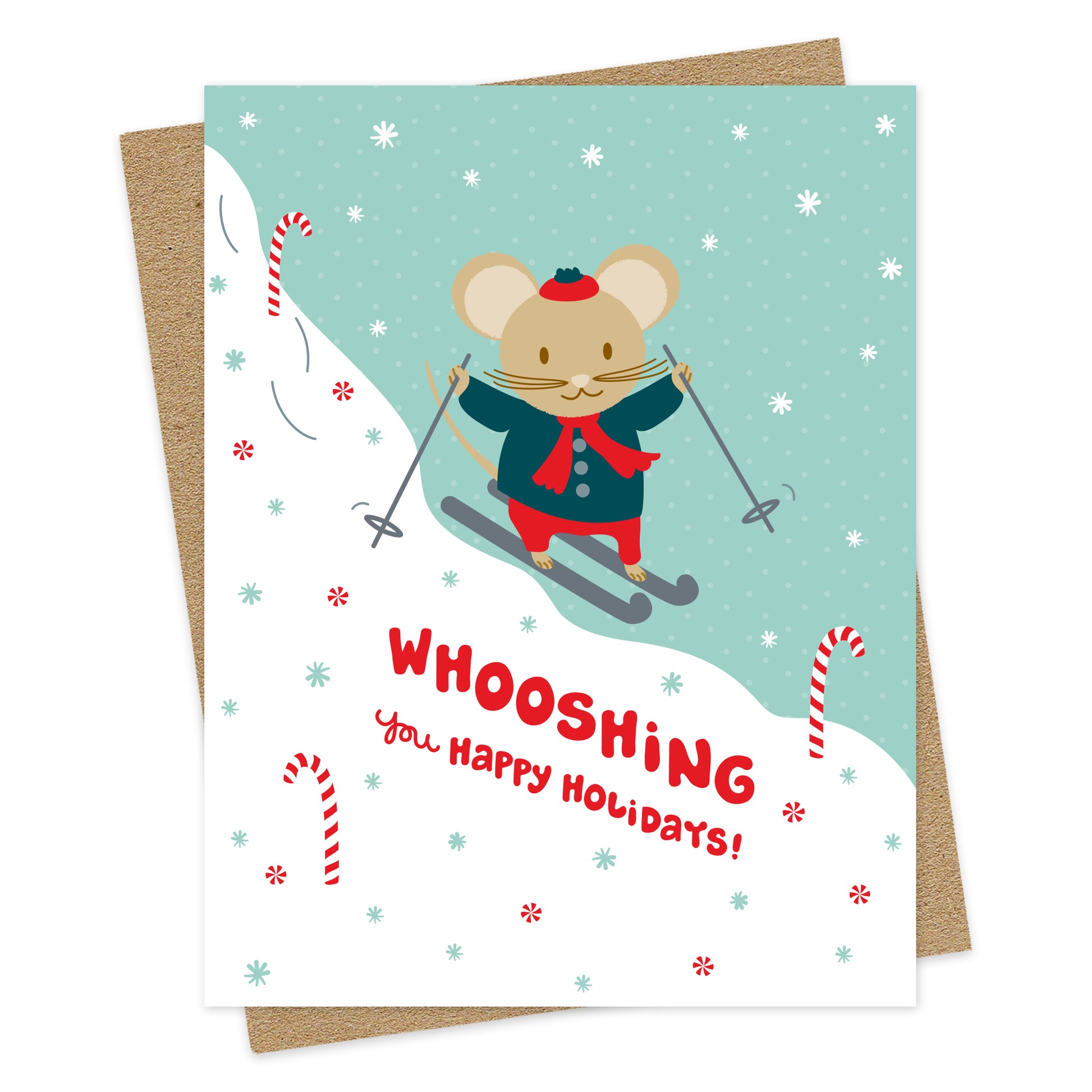 Front of Skiing Mouse folded holiday greeting card featuring an illustrated mouse skiing through a snowy scene with falling snowflakes, candy canes and a “Whooshing You Happy Holidays!” greeting. Pictured with a kraft envelope.