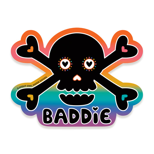 Sticker with a black skull and crossbones design on a rainbow gradient background, featuring the word "BADDIE."