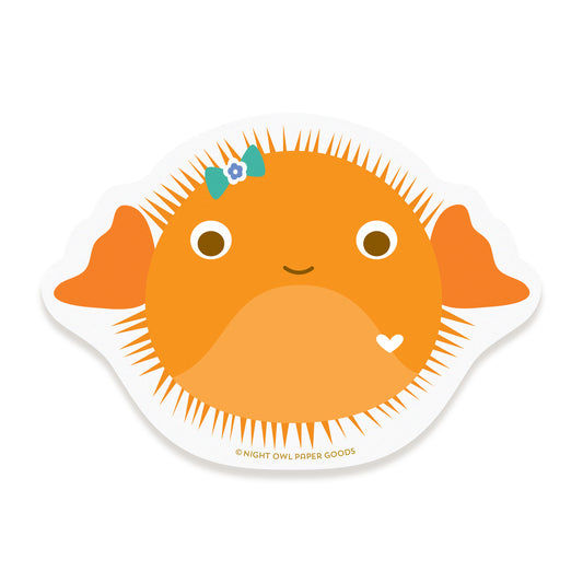 Vinyl sticker featuring an orange puffer fish with a bow on a white background.