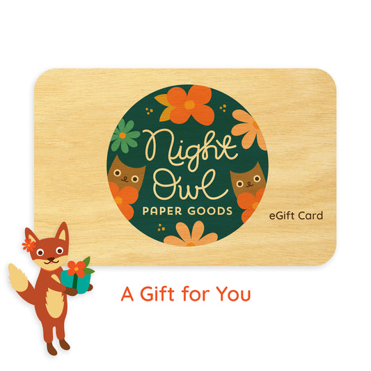 Wooden e-gift card with Night Owl Paper Goods logo and fox illustration alongside "A Gift For You" text.