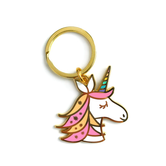 Gold metal unicorn enamel keychain with pink and peach flowing mane, gold star accents and rainbow striped horn on a gold key ring