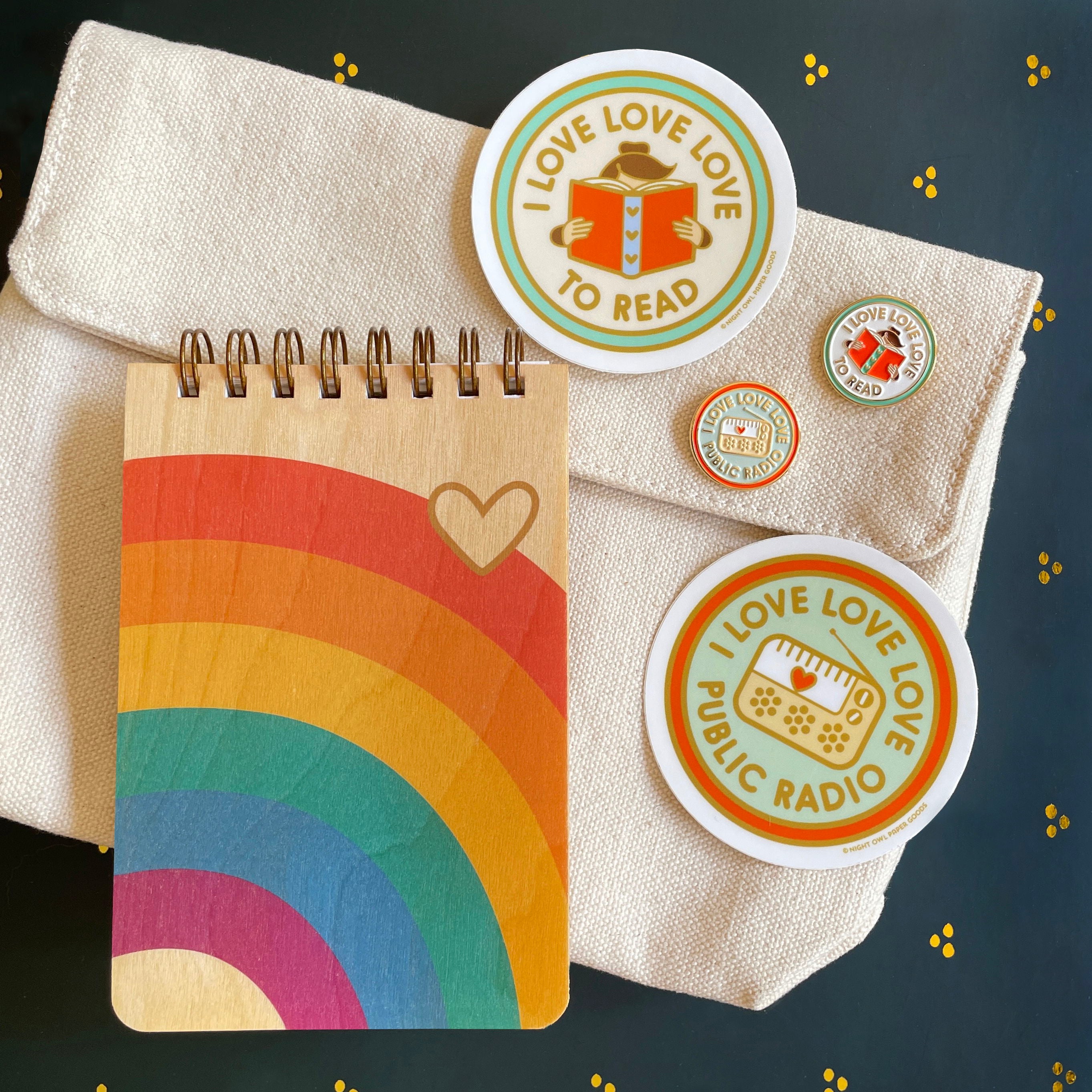 Rainbow notepad, Love to Read sticker and pin, Love Public Radio sticker and pin
