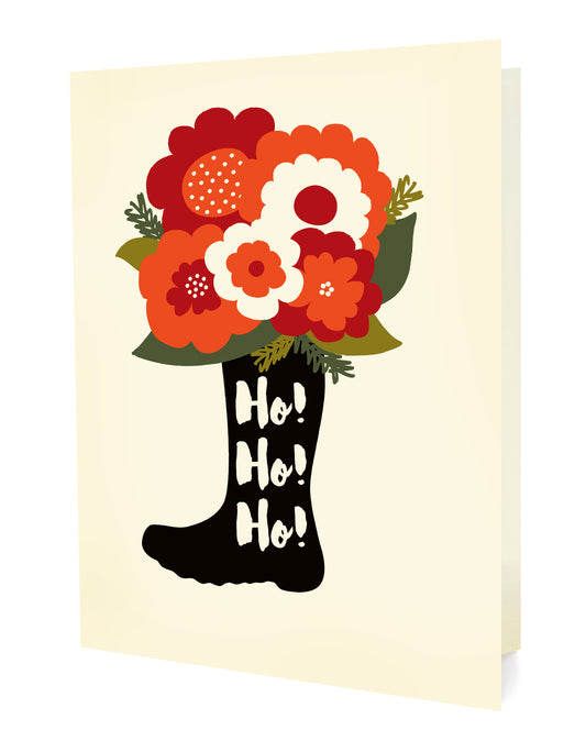 Front of a folded holiday card featuring a black Santa boot overflowing with colorful flowers and “Ho! Ho! Ho!” text on an off-white background.
