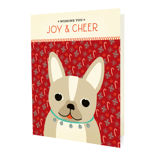 Front of folded holiday card featuring a French bulldog wearing a jingle bell collar on a red festive background with “Wishing You Joy & Cheer” text.
