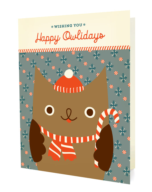 Front of a folded holiday card with an illustrated owl wearing a red hat and scarf, holding a candy cane, on a festive blue-grey background with "Wishing You Happy Owlidays" text.