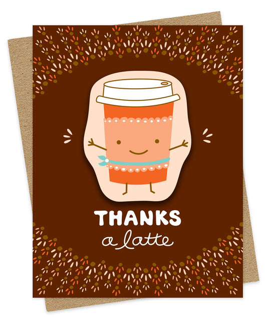 Thank You card with a removable vinyl sticker of a happy to-go coffee cup and the message “Thanks a Latte”  on a brown background. Pictured with a kraft envelope.