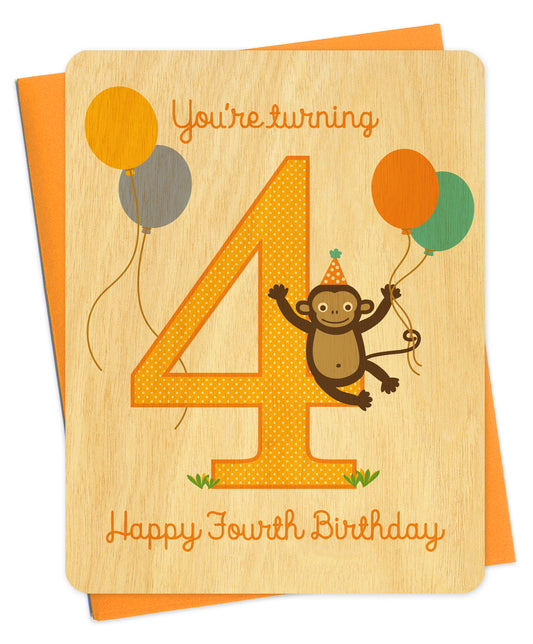 Happy Fourth Birthday card with a monkey and balloons. Card is made from wood.