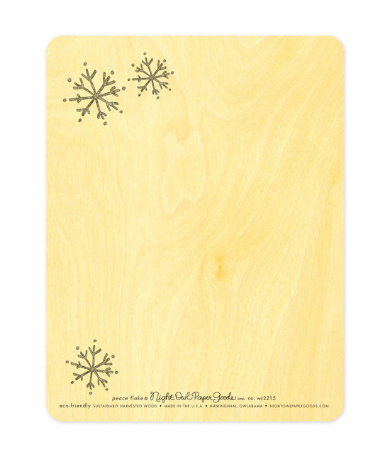 Back of Peace Flake wood holiday card, which features small snowflake designs in two corners and space for a handwritten message. Along the bottom is the company logo and text that reads "eco-friendly sustainably harvested wood - made in the usa - birmingham, owlabama - nightowlpapergoods.com"