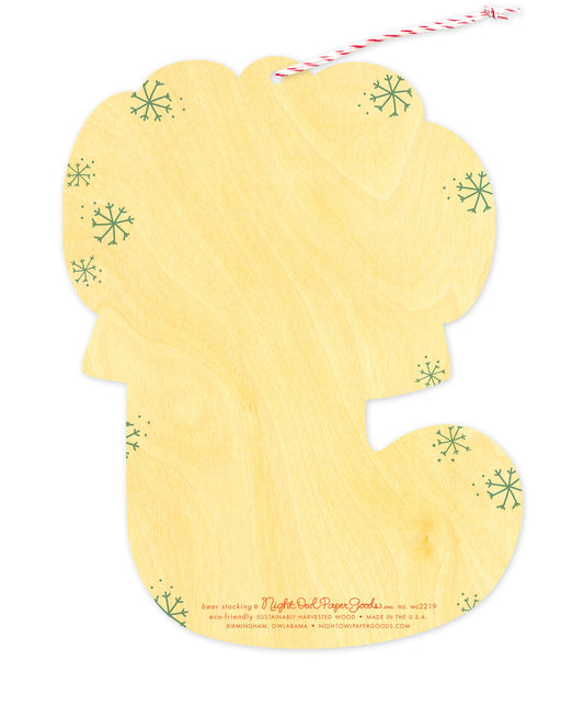 Back of Bear Stocking Wood Holiday Card & Ornament, which is die-cut in the shape of a stocking and features snowflake design elements on the sides and space to write a personal greeting. Along the bottom is the company logo and text that reads "eco-friendly sustainably harvested wood - made in  birmingham, owlabama - nightowlpapergoods.com"

