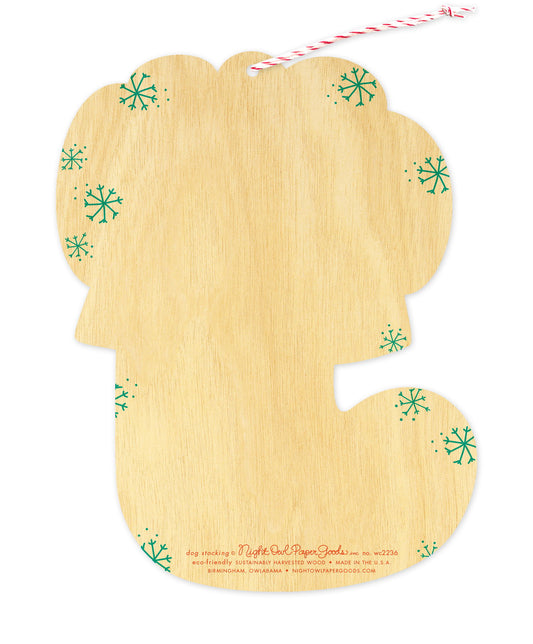 Back of Dog Stocking wood ornament holiday card, which is die-cut in the shape of a stocking and features snowflake design elements on the sides and space to write a personal greeting. Along the bottom is the company logo and text that reads "eco-friendly sustainably harvested wood - made in  birmingham, owlabama - nightowlpapergoods.com