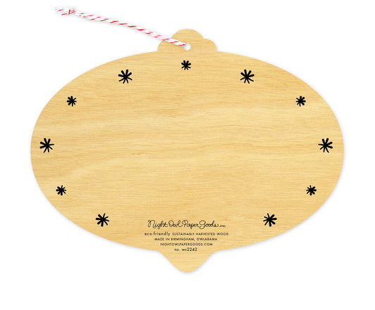Back of Burst of Joy wood holiday ornament card, which is die-cut in the shape of a bulb and features black star design elements on the edges and space to write a personal greeting. Along the bottom is the company logo and text that reads "eco-friendly sustainably harvested wood - made in  birmingham, owlabama - nightowlpapergoods.com"