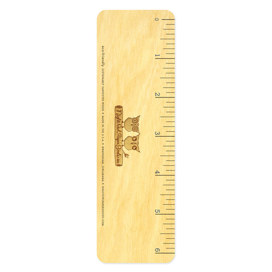 Back of wooden octopus bookmark with ruler measurement markings.