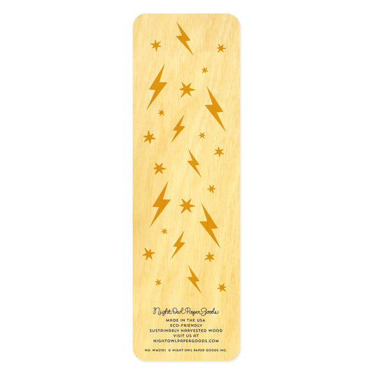 Back side of wooden bookmark with lightning bolt and star patterns on a white background