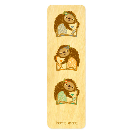 Wooden bookmark with three sloths hugging books 