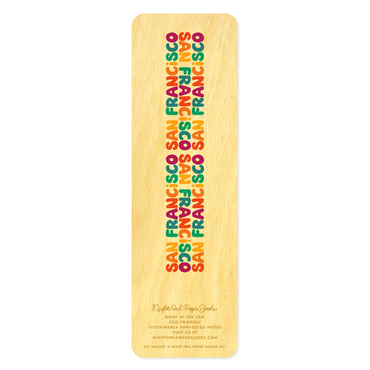 Back side of wooden bookmark features colorful text in a rainbow of colors that reads San Francisco three times