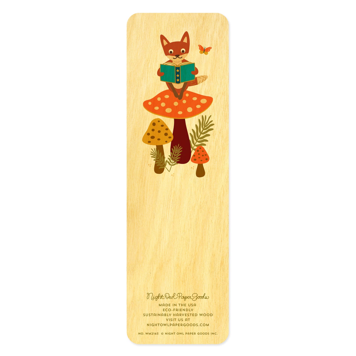 Back side of wooden bookmark with fox sitting on a big mushroom reading a book