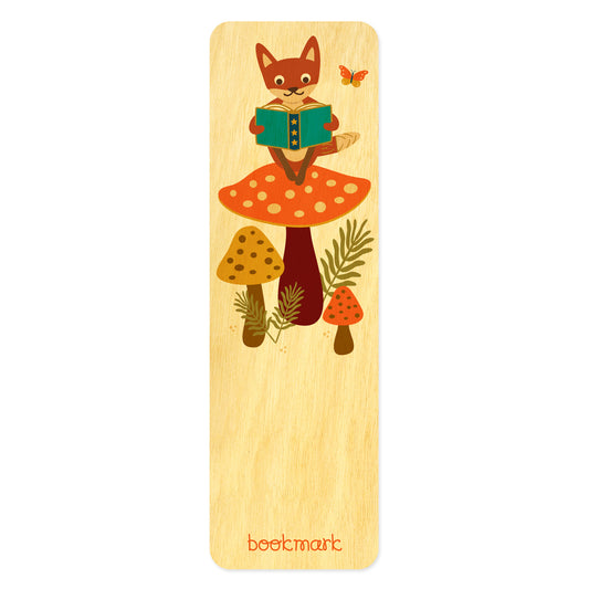 Wooden bookmark with fox sitting on a big mushroom reading a book 