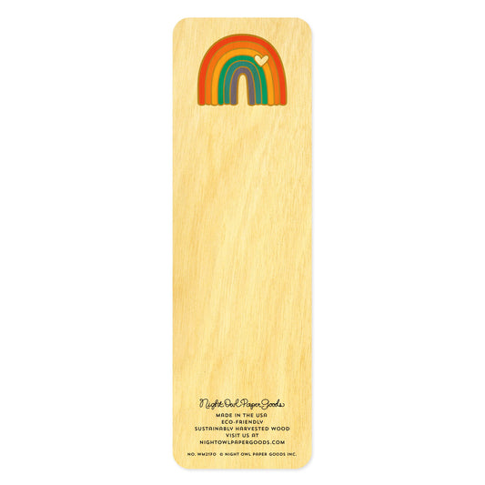 Back side of wooden bookmark features a colorful rainbow with a little white heart 