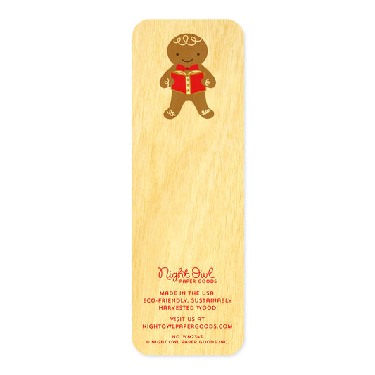 Back of Gingerbread birch wood mini bookmark, featuring a smiling gingerbread cookie holding a red book with decorative details. At the bottom, the Night Owl Paper Goods script logo appears above text reading "Made in the USA - Eco-Friendly Sustainably Harvested Wood - Visit us at nightowlpapergoods.com."